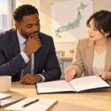 Employee discussing a workplace transfer notice with an HR colleague