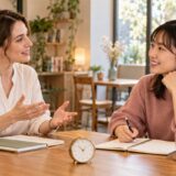 One-to-one English lesson with a discreet clock on the table
